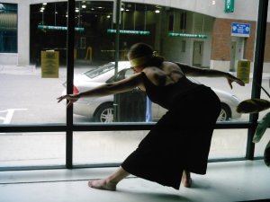Here's Anna B when she was a professional dancer.  I love this picture because she allows us to do things to her like as her to dance blindfolded in a store window downtown.  Also, if I had a picture of my back muscles looking like that I'd want it to be used in my profile always.  